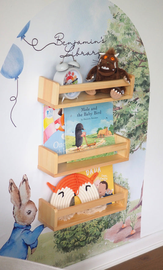 Peter Rabbit themed bookshelf with a personal decal