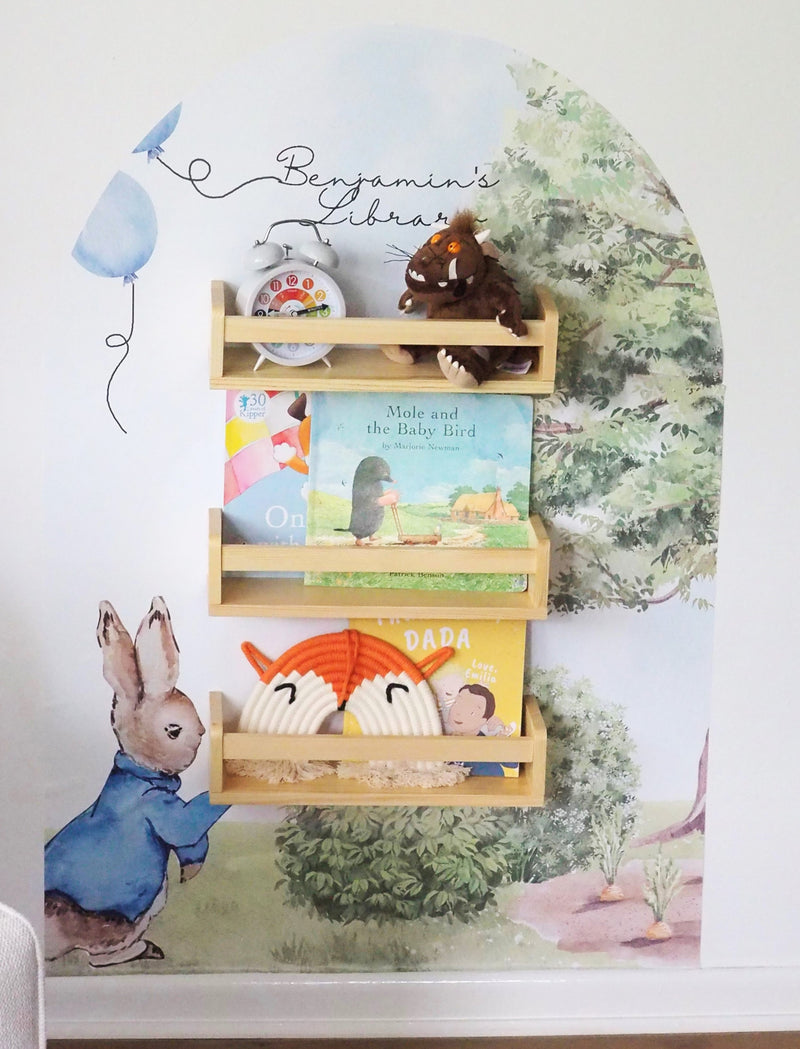 Peter Rabbit themed bookshelf with a personal decal