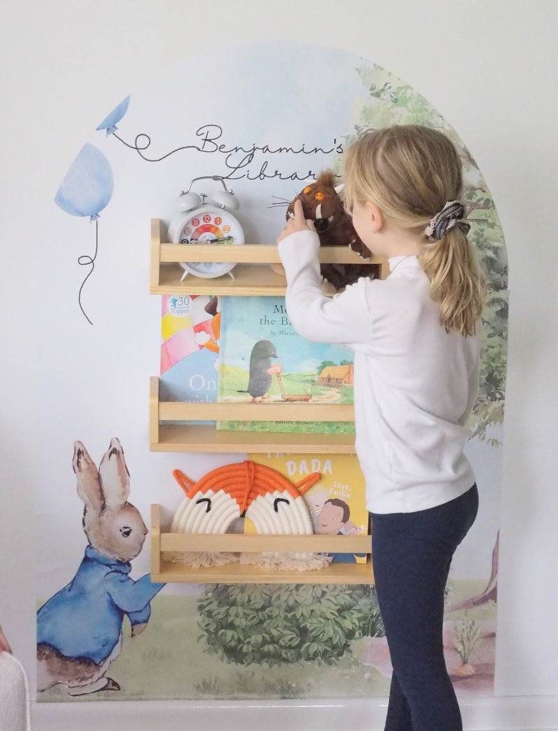 Peter Rabbit themed bookshelf with a personal decal